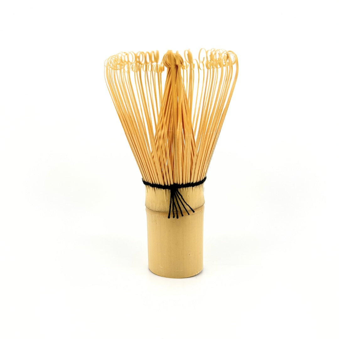 Traditional bamboo matcha whisk (chasen) used for frothing ceremonial matcha.