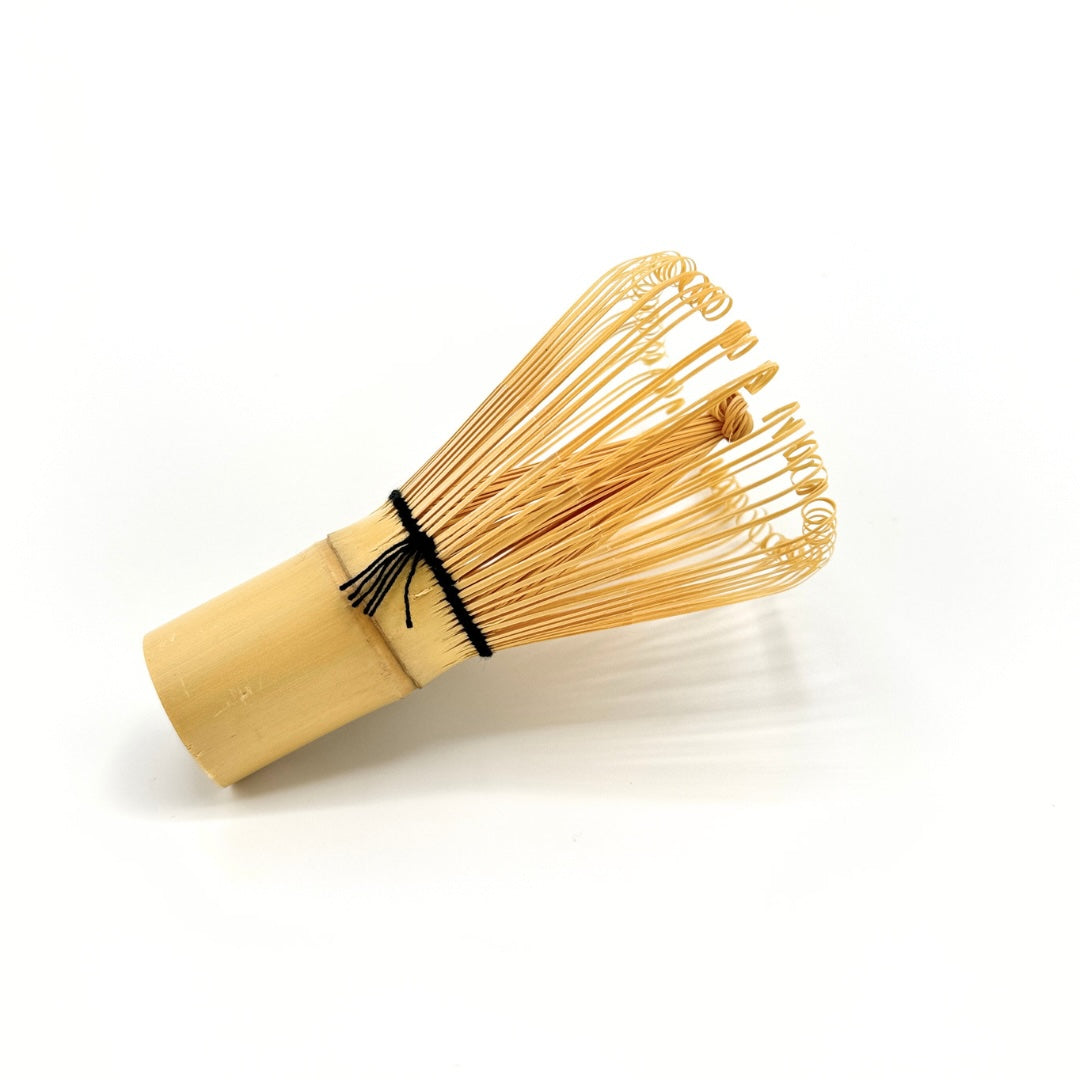 Traditional bamboo matcha whisk (chasen) used for frothing ceremonial matcha.